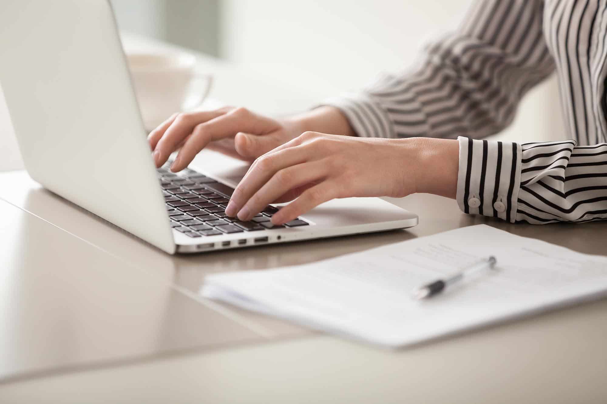 Businesswoman working on laptop, female hands typing on keyboard Prioritized-Detailed-Recommendations